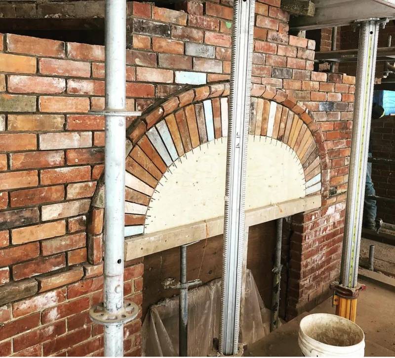 Brick arch built over a wide garage opening