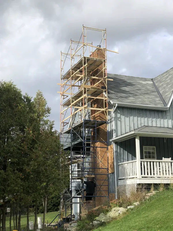 Heritage home under scaffold during a masonry restoration
