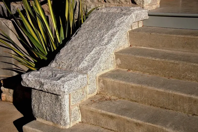 Stone steps and a paver walkway with new planting beds